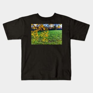 Yellow birch leaves in autumn season with green grass background Kids T-Shirt